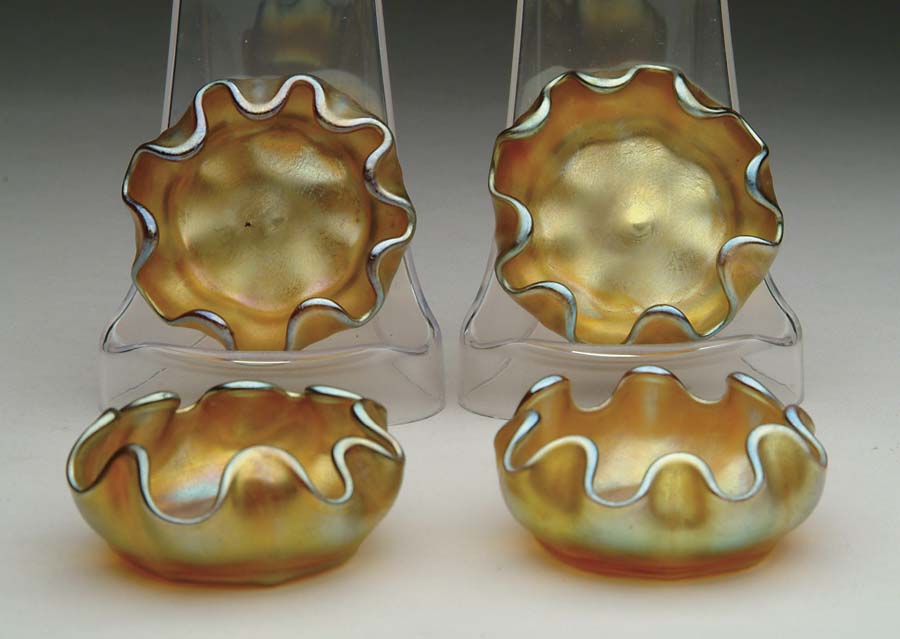 Appraisal: FOUR TIFFANY SALTS Four Tiffany salts have nice gold iridescent