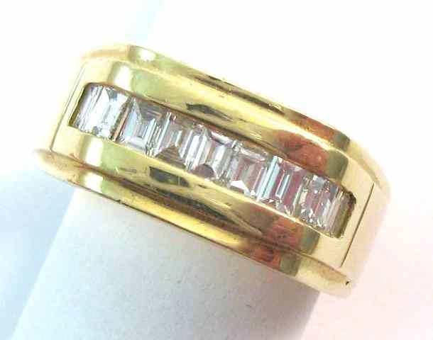 Appraisal: MAN'S DIAMOND AND FOURTEEN KARAT GOLD RING set with nine