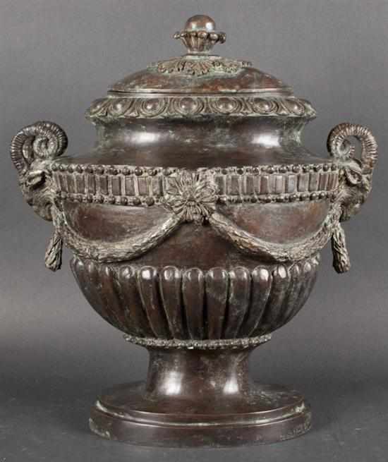 Appraisal: Classical style patinated bronze urn with ram's head mask handles