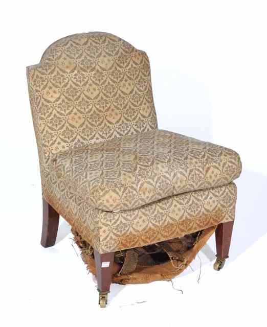 Appraisal: A VICTORIAN HOWARD SONS NURSING CHAIR on square tapering supports