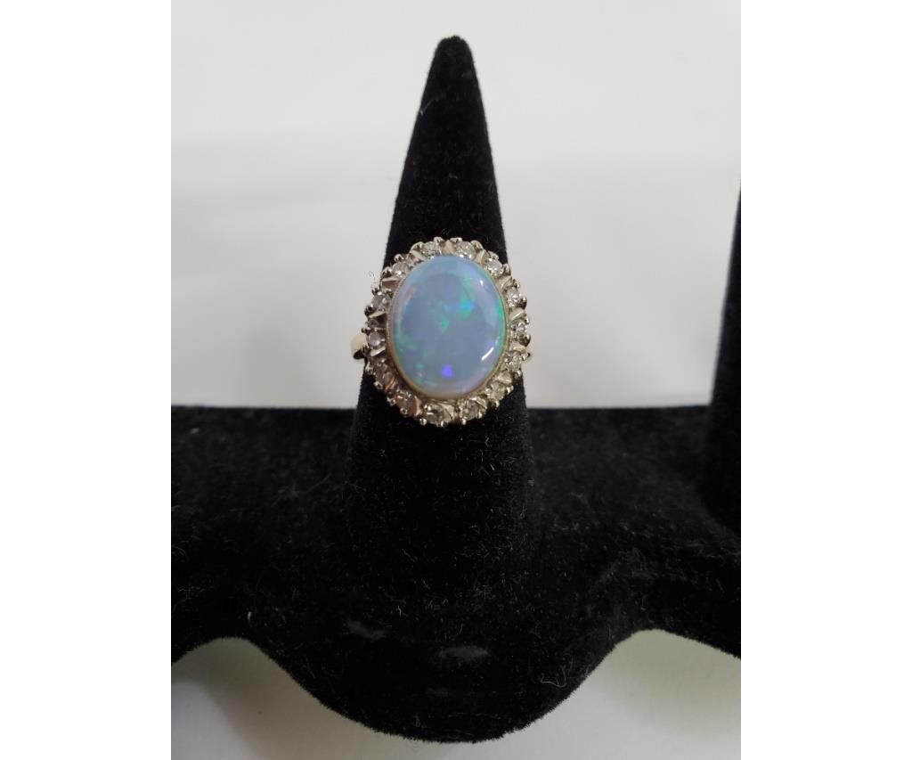 Appraisal: k gold opal cocktail rings with old mine cut diamonds