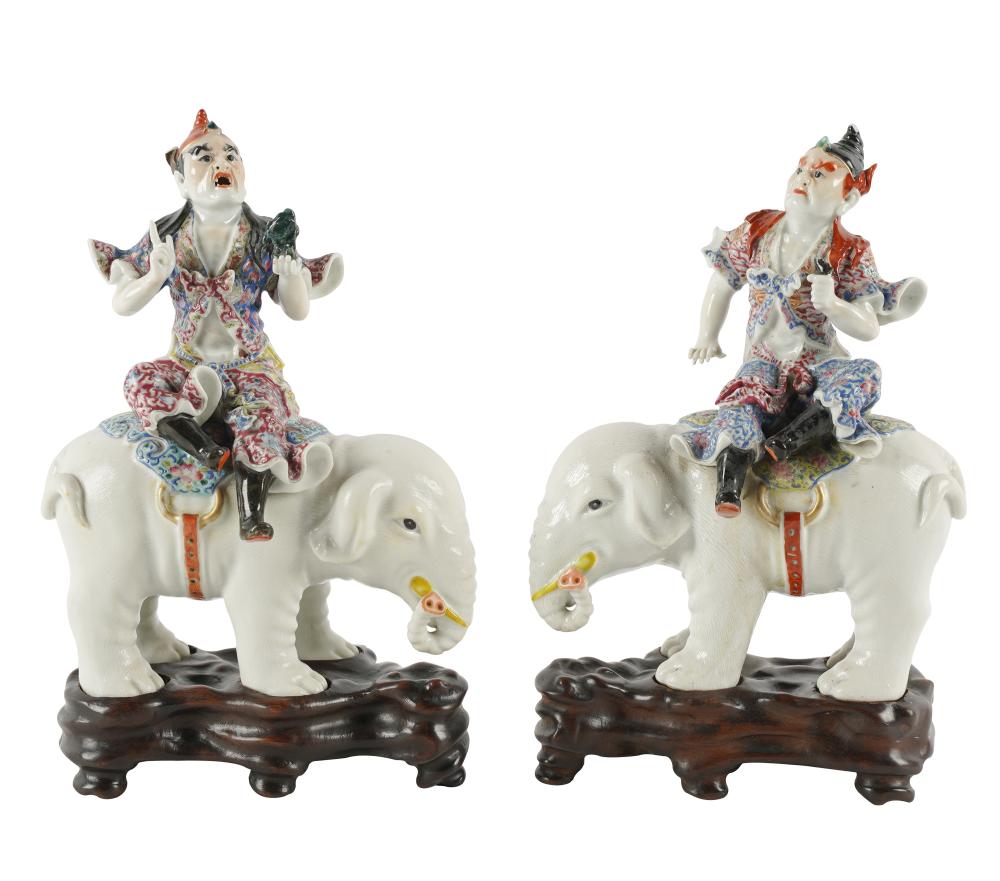 Appraisal: PAIR CHINESE PORCELAIN FIGURES ON ELEPHANTSunmarked each with fitted hardwood