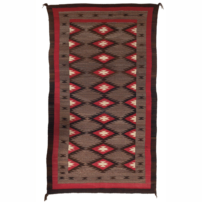 Appraisal: Navajo rug c serrated diamond pattern in red brown and