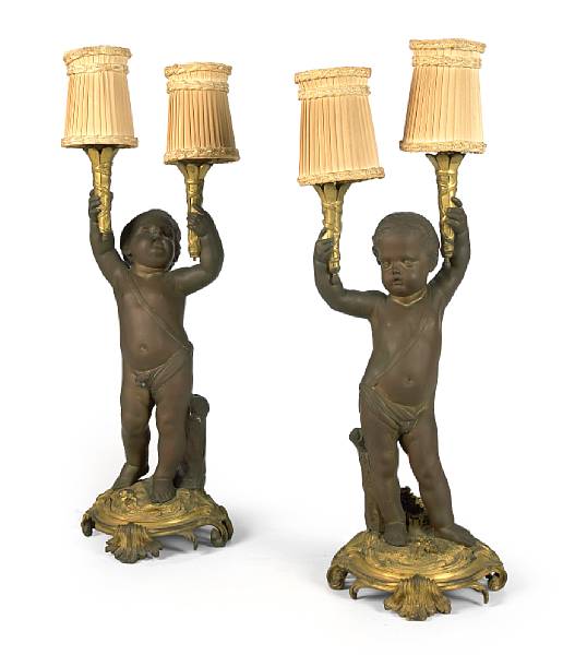 Appraisal: A pair of French gilt and patinated bronze two light