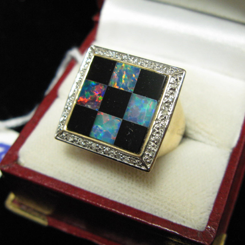 Appraisal: DIAMOND OPAL BLACK ONYX AND FOURTEEN KARAT GOLD RING having