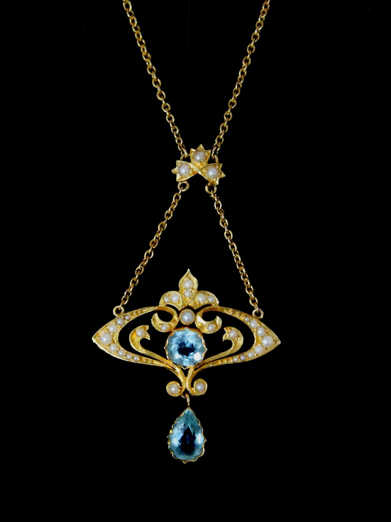 Appraisal: A split pearl and aquamarine pendant in a ct gold