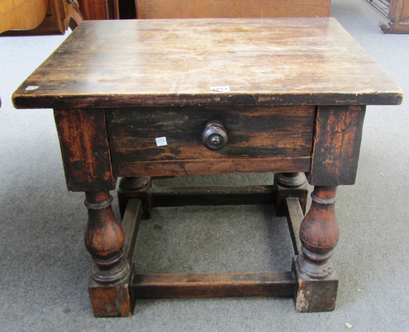 Appraisal: A th century continental stained beech single drawer low table