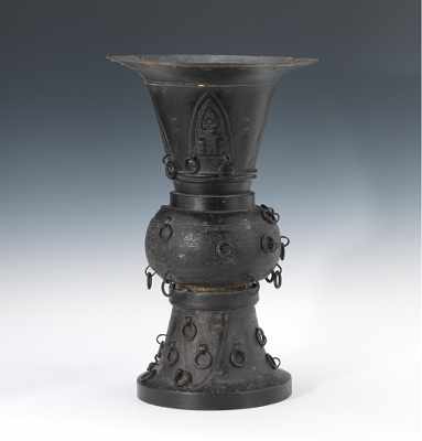 Appraisal: An Archaistic Bronze Vessel Tall bronze gu shape vessel with