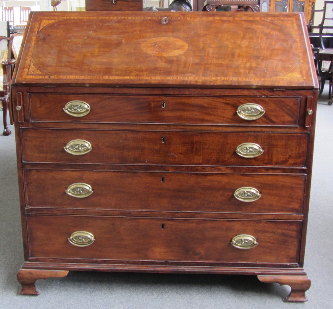 Appraisal: A George III inlaid mahogany bureau the fitted interior over