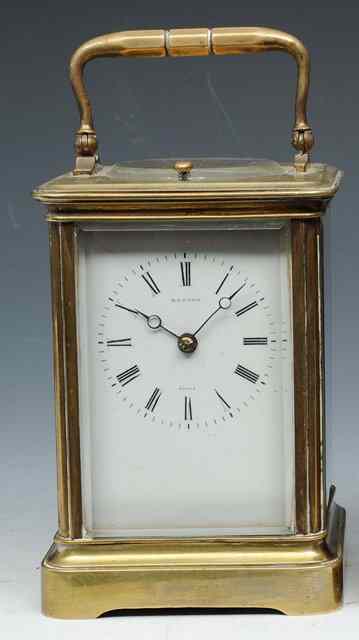 Appraisal: A FRENCH BRASS CARRIAGE CLOCK with white enamel Roman dial