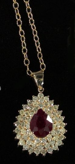 Appraisal: Fourteen-Karat Yellow Gold Ruby and Diamond Pendant Necklace composed of