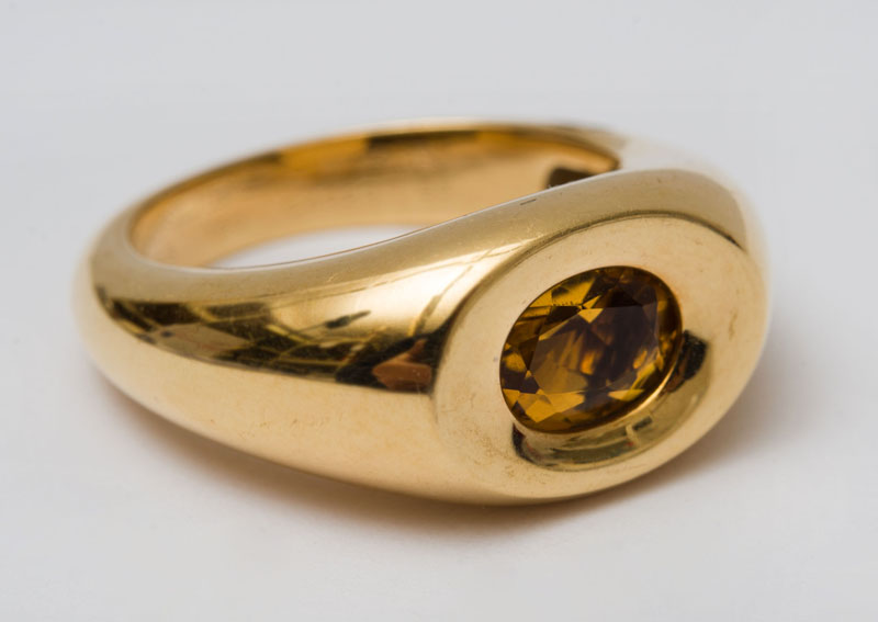 Appraisal: MAUBOUSSIN K GOLD AND CITRINE RING Recessed center set with