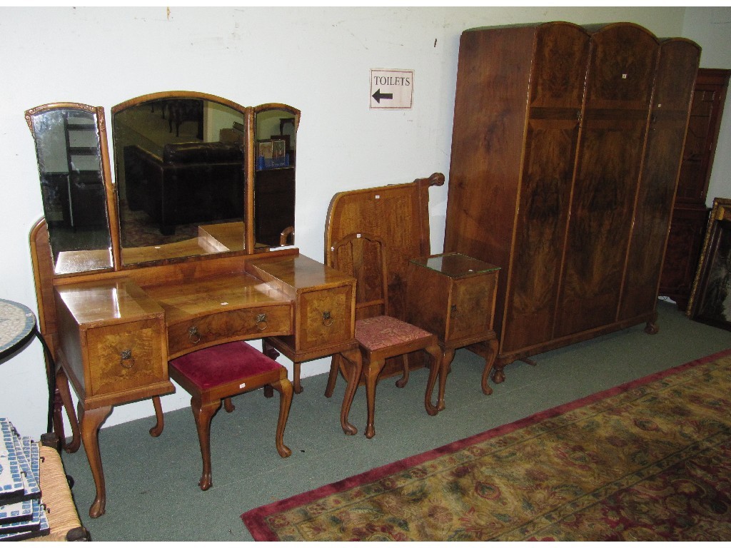 Appraisal: Walnut veneered bedroom suite comprising triple wardrobe dressing table stool