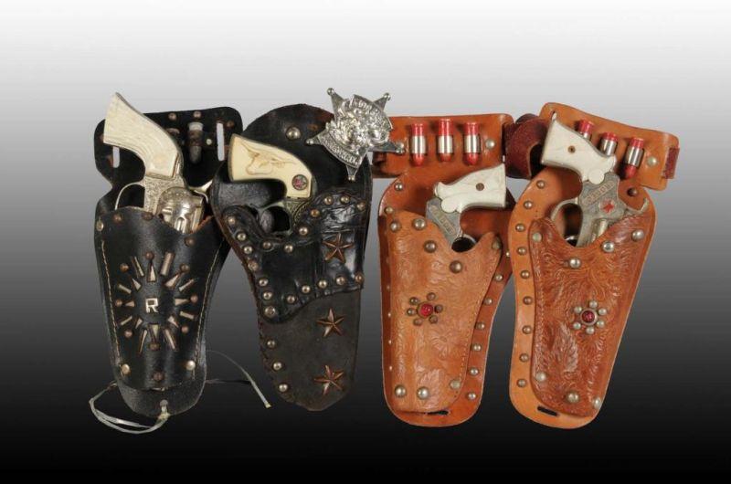 Appraisal: Lot of Cowboy Toy Cap Gun Holster Sets Description Includes