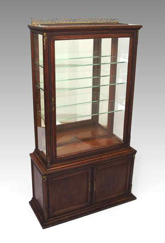 Appraisal: DIMINUTIVE OAK DISPLAY CABINET Brass gallery single glass door mirror