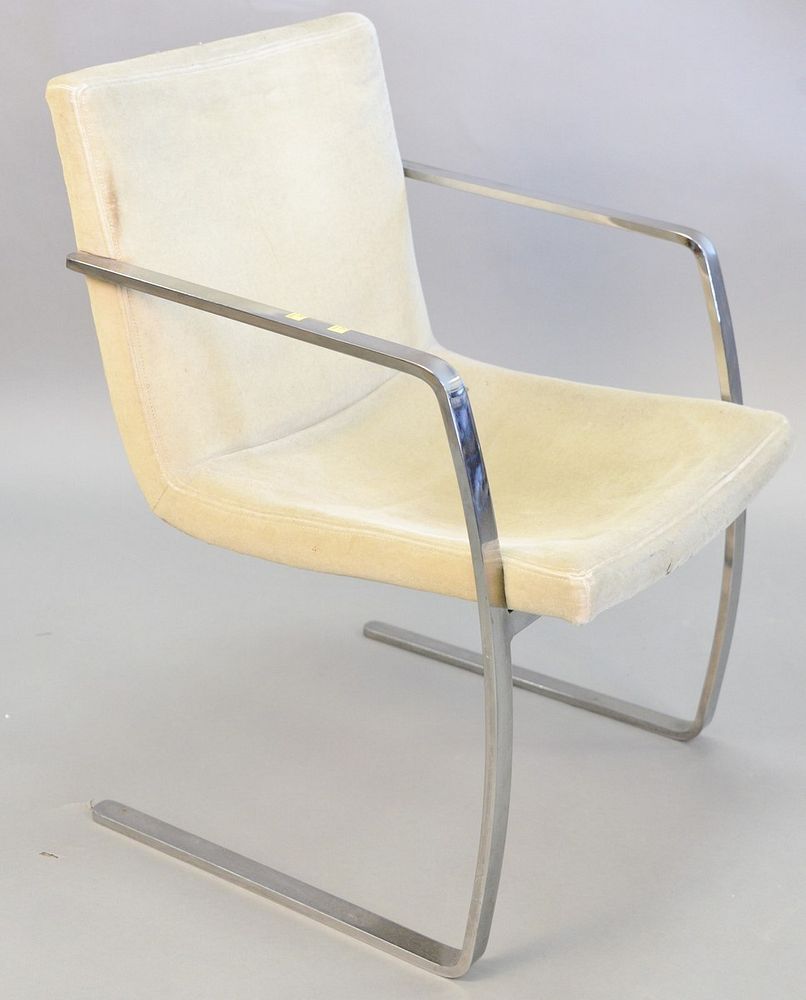 Appraisal: Contemporary armchair continuous metal arms terminating to legs green upholstery