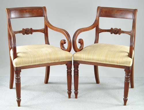 Appraisal: PAIR OF MAHOGANY SHERATON ARMCHAIRS Turned front legs back sweeping