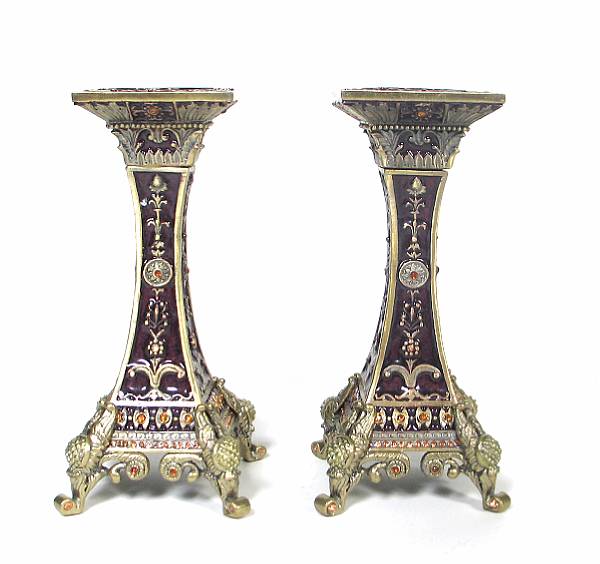 Appraisal: A set of four enameled candlesticks height in