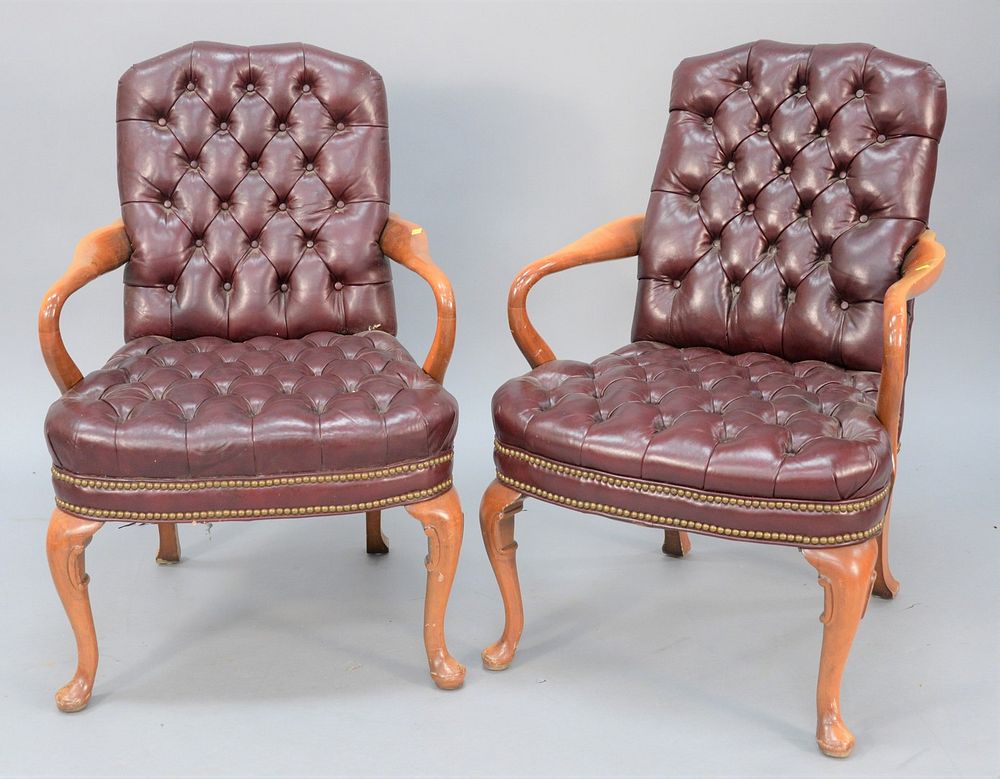 Appraisal: Pair of tufted leather armchairs Pair of tufted leather armchairs