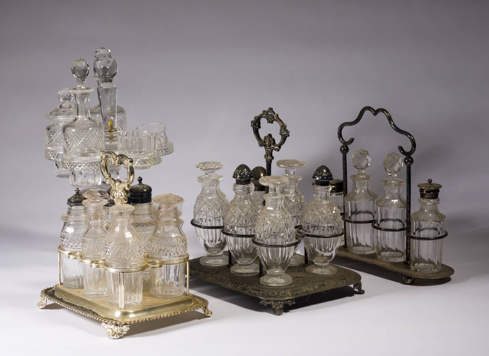 Appraisal: FOUR ENGLISH CRYSTAL AND SILVERPLATE CASTER SETS Height of tallest