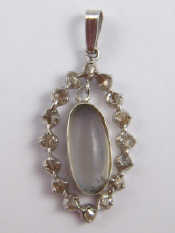 Appraisal: A white metal tests silver moonstone and diamond pendant approx