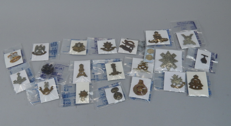 Appraisal: A quantity of military cap badges to include The North