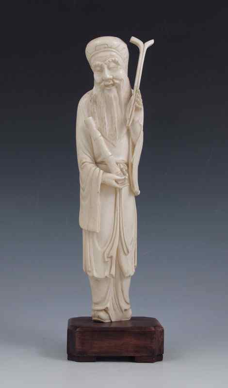 Appraisal: CHINESE CARVED IVORY WISE MAN In flowing robes holding stick