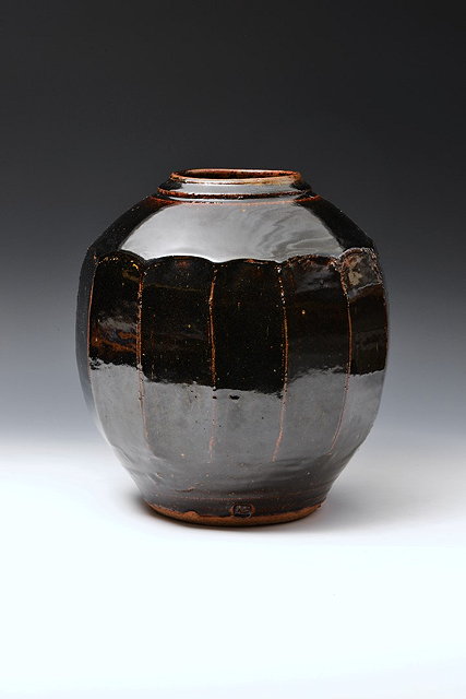 Appraisal: Warren MacKenzie American b Vase cut sidedtenmoku glaze cm high