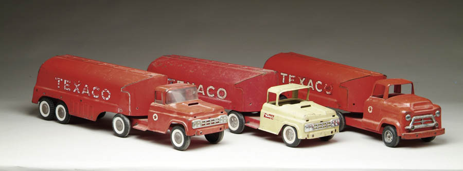 Appraisal: THREE BUDDY L TEXACO TRUCKS Including a s truck painted