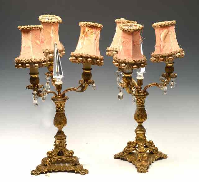 Appraisal: A PAIR OF ORMOLU THREE BRANCH CANDELABRA with central pointed