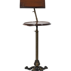 Appraisal: An English Mahogany and Brass Table with Adjustable Book Shelf