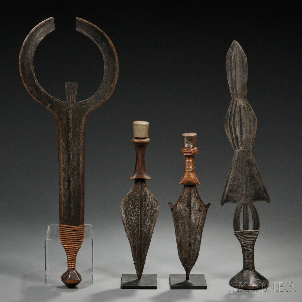 Appraisal: Four African Weapons includes an Ngombe sword a human-shaped form