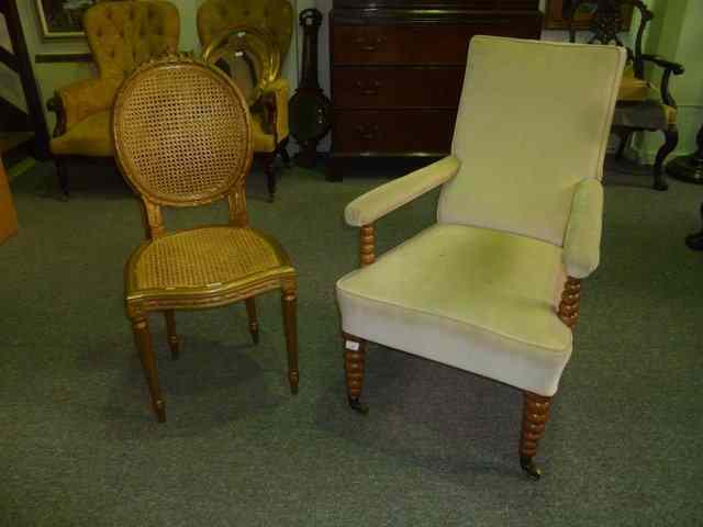 Appraisal: A VICTORIAN ROSEWOOD FRAMED ARMCHAIR on tapering bobbin supports with