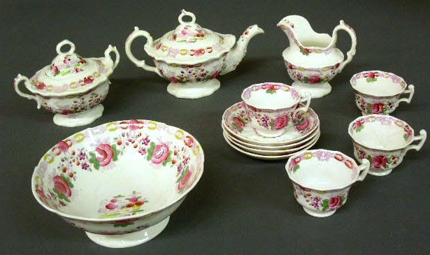 Appraisal: English porcelain tea set with rose pattern- teapot sugar creamer