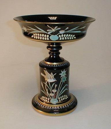 Appraisal: A large Victorian black glass centrepiece with enamelled decoration of