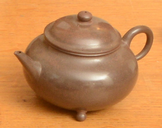 Appraisal: A CHINESE XIJING TERRACOTTA TEAPOT AND COVER on three feet