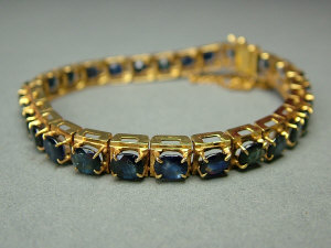 Appraisal: An Indian k gold and sapphire line bracelet of articulated