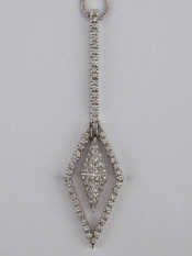 Appraisal: A white metal tests carat gold diamond pendant necklace pendant