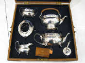 Appraisal: A tea set of oval bellied form with broad pierced