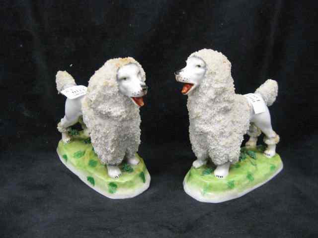 Appraisal: Pair of German Porcelain Figurines of Spaniels textured ''hair'' ''