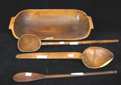 Appraisal: Large wooden bowl Together with three wooden spoons one damaged