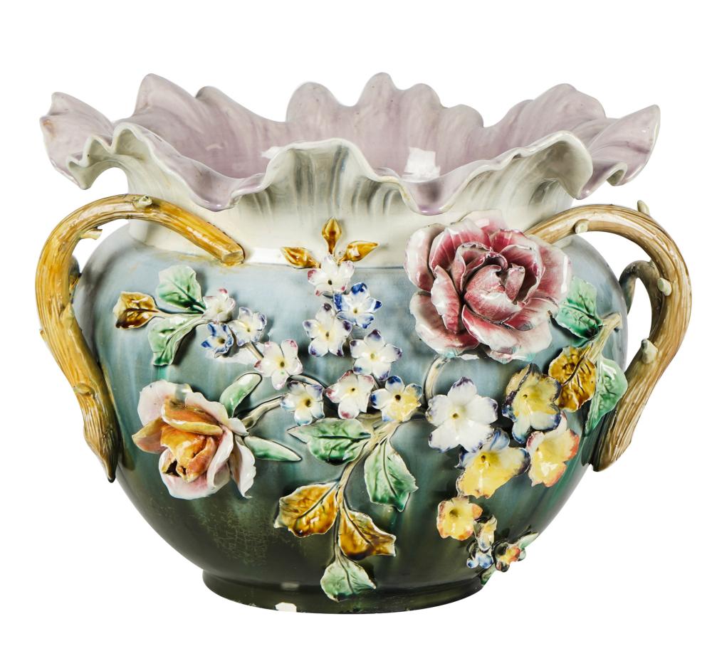 Appraisal: GLAZED CERAMIC JARDINIEREunmarked decorated with molded flowers and flanked by