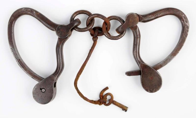 Appraisal: Adams Handcuffs With Key Patent applied for Brown patina Fifteen