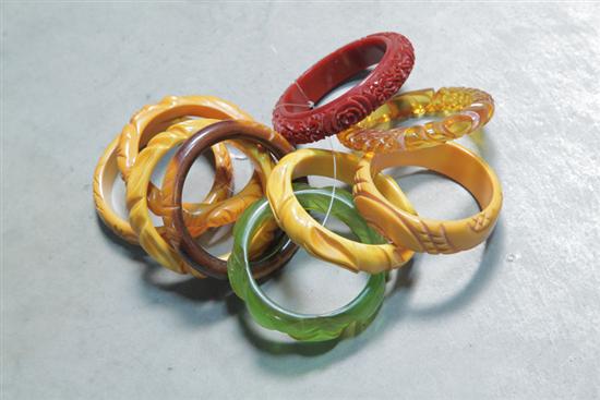 Appraisal: NINE BAKELITE BRACELETS All bangles All carved with floral motifs