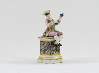 Appraisal: A Continental porcelain figure of Harlequin possibly Furstenberg wearing a