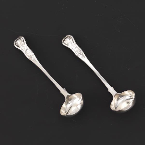 Appraisal: PAIR OF SCOTTISH STERLING SILVER LADLES KING'S PATTERN GEORGE IV