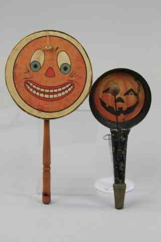 Appraisal: HALLOWEEN NOISE MAKERS Paper face pumpkin on tin horn and