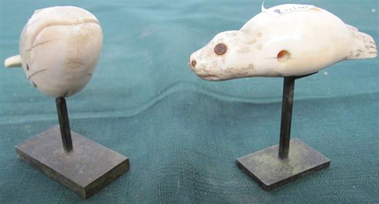 Appraisal: TWO ANTIQUE INUIT CARVED IVORY FIGURES A group of two