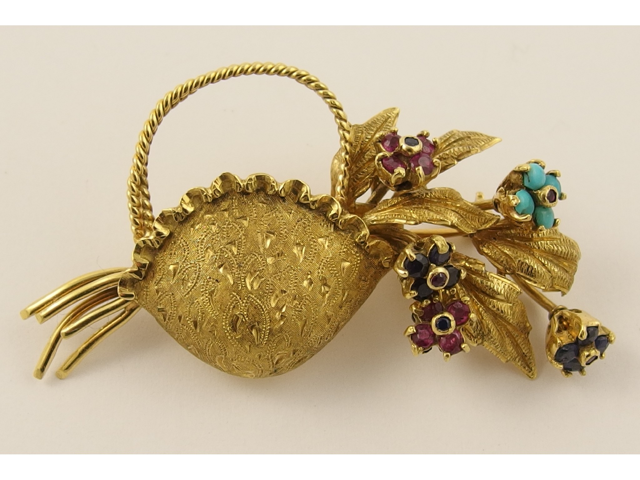 Appraisal: An ct flower basket brooch set with sapphire ruby and