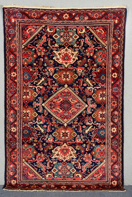 Appraisal: A MAHAL BLUE GROUND RUG decorated with a central diamond